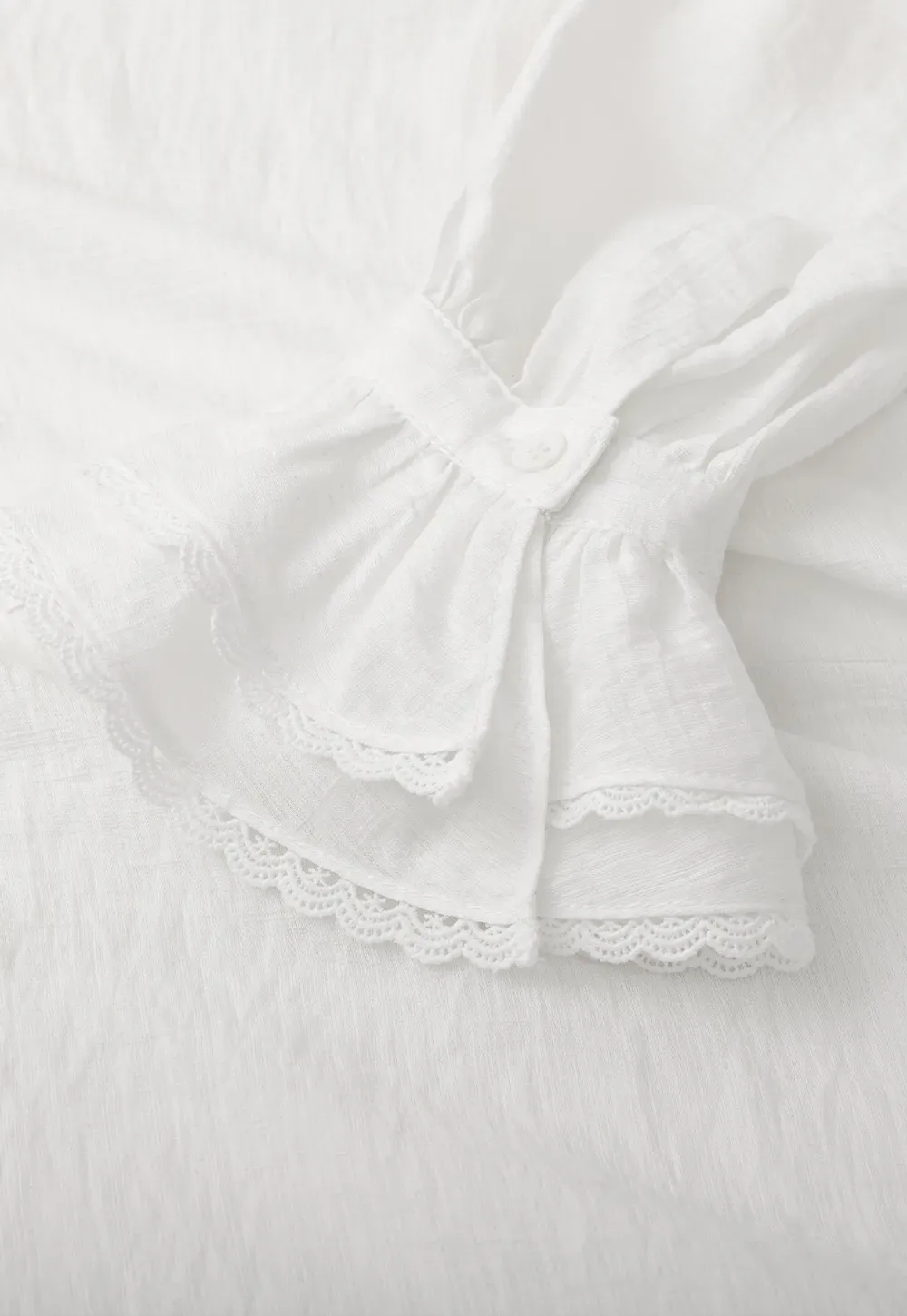 Elegant Blouse with Ruffled Neckline and Flared Sleeves