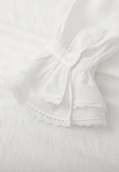 Elegant Blouse with Ruffled Neckline and Flared Sleeves