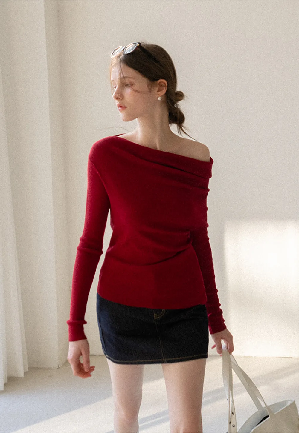 A-line denim skirt with front pocket design and adjustable waistband.