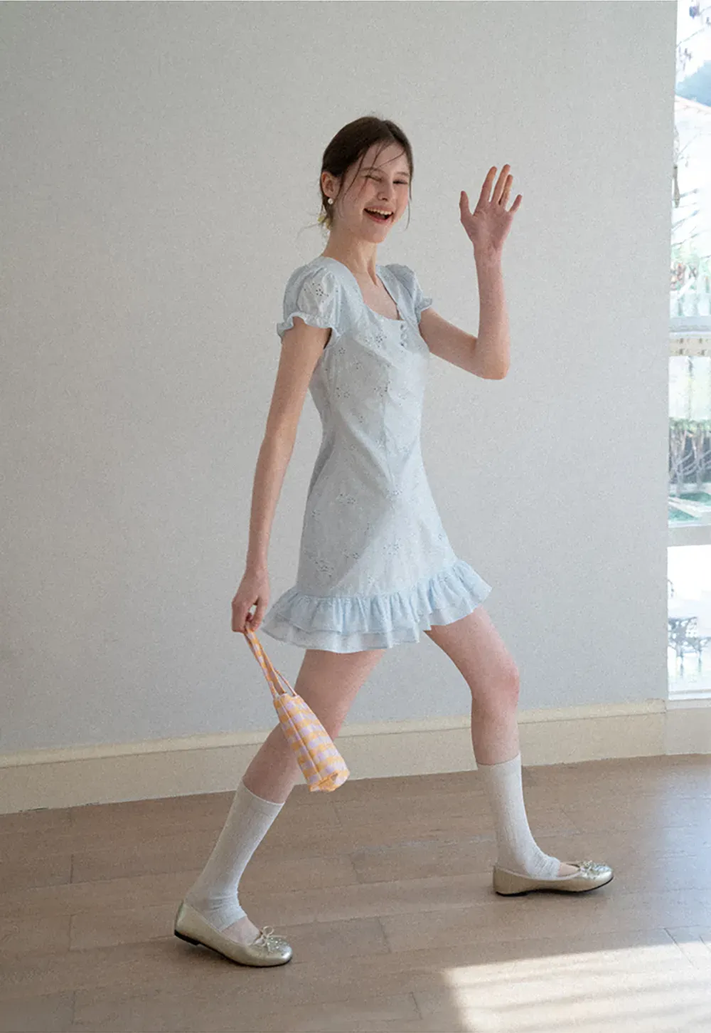 Eyelet dress with puff sleeves and ruffled hem