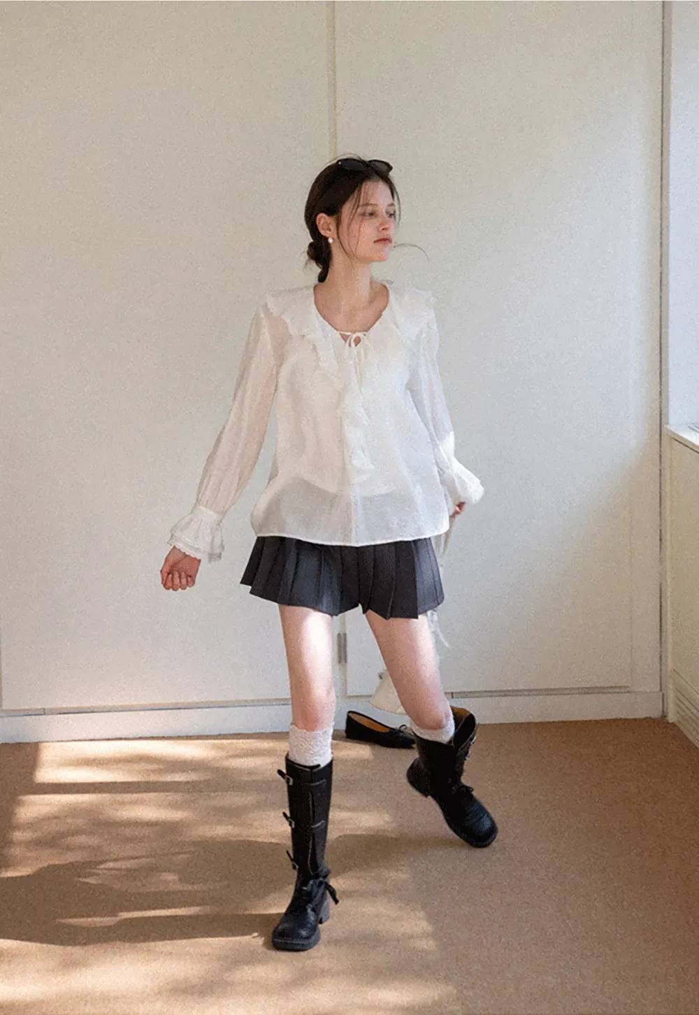 Elegant Blouse with Ruffled Neckline and Flared Sleeves