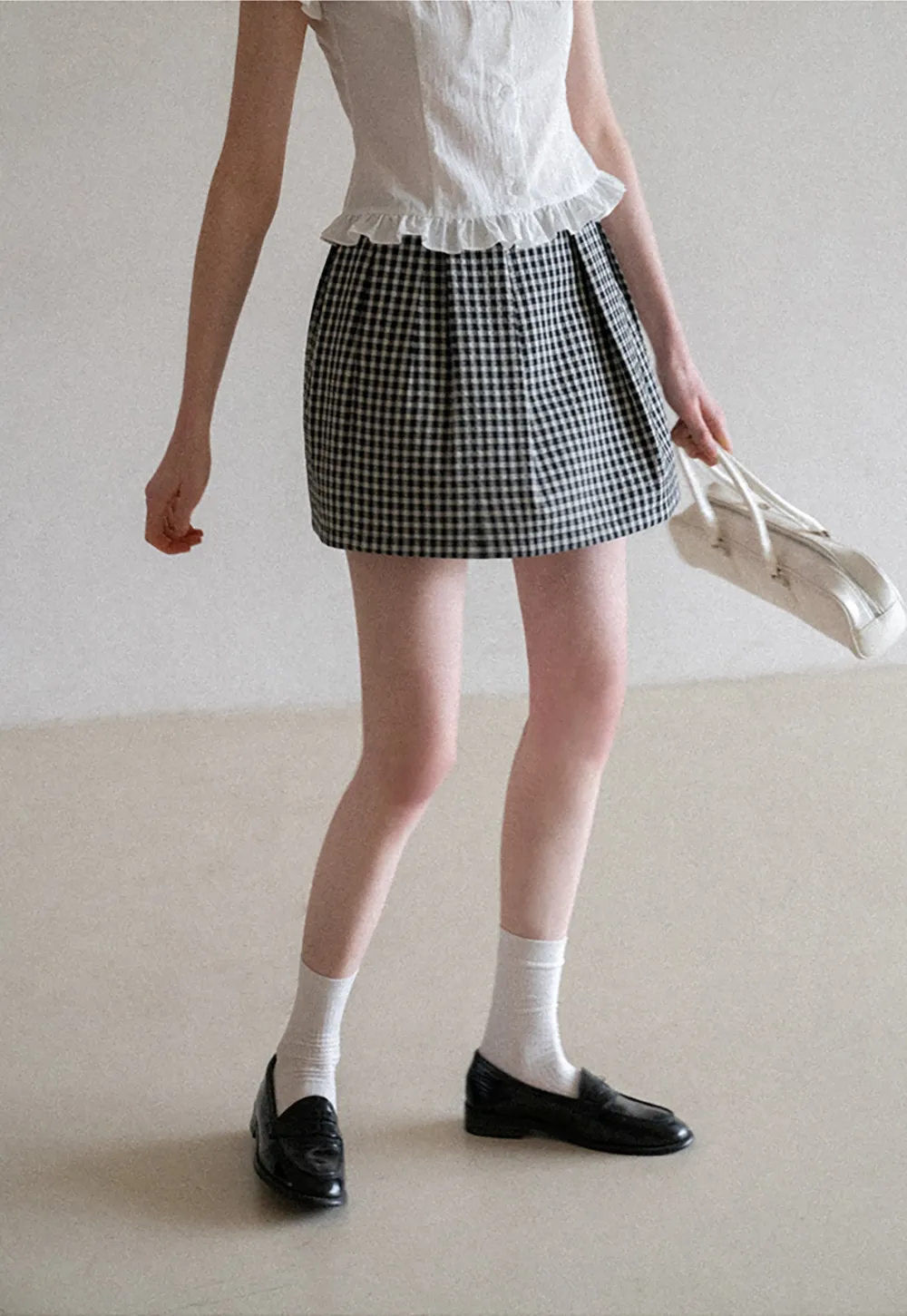 Plaid skirt with pleats and ruffled top