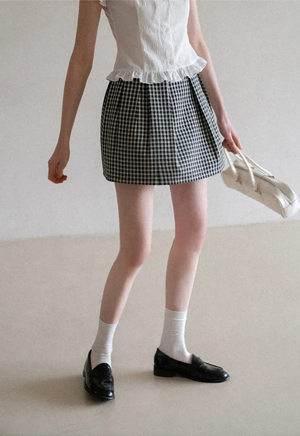 Plaid skirt with pleats and ruffled top