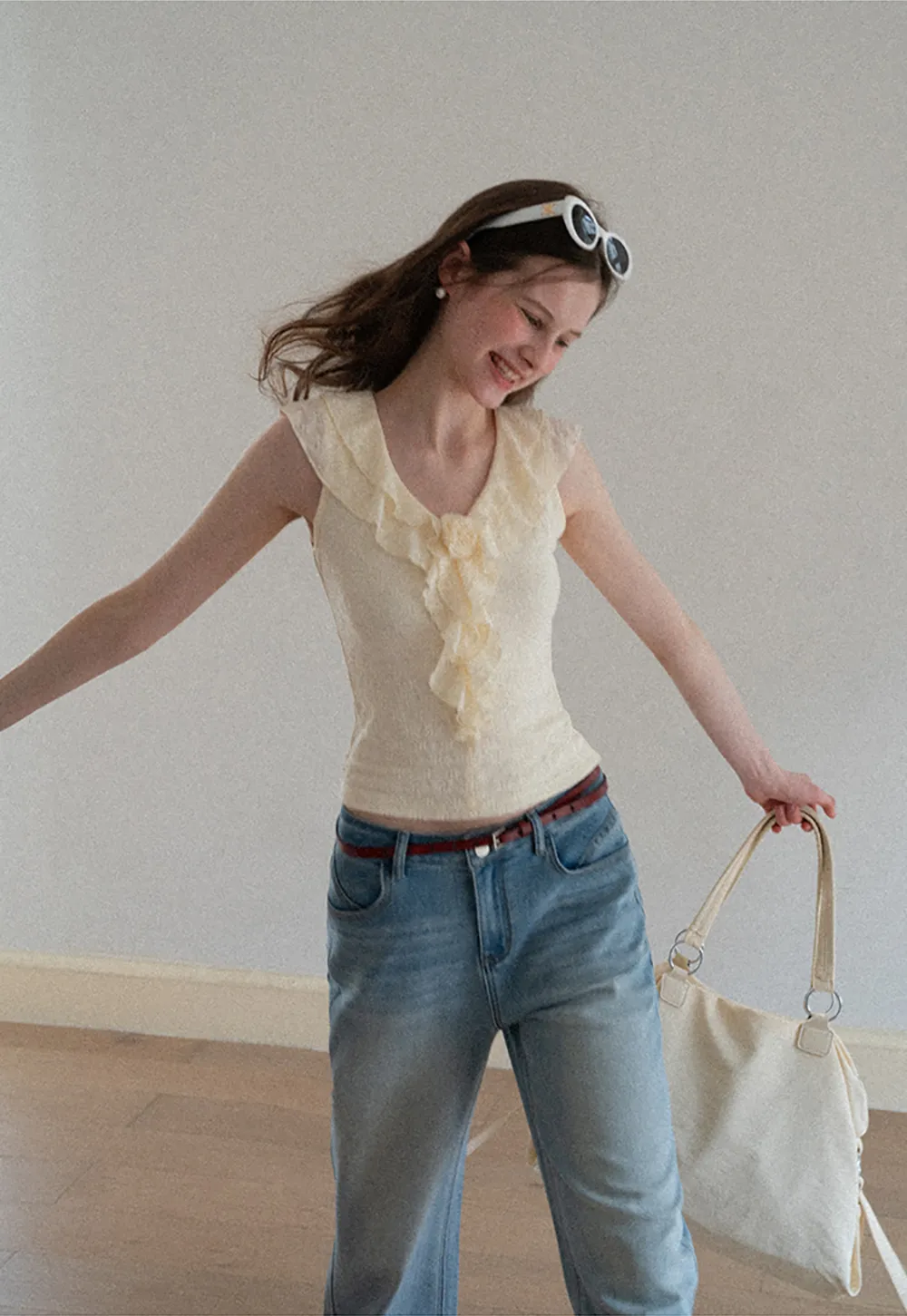 Sleeveless Top with Ruffled V Neck and Floral Detail