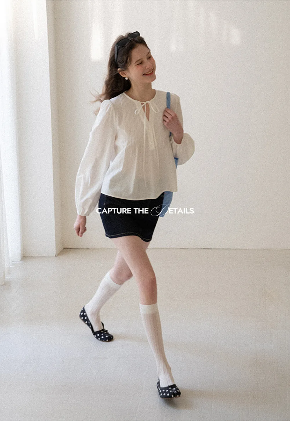 A-line denim skirt with front pocket design and adjustable waistband.