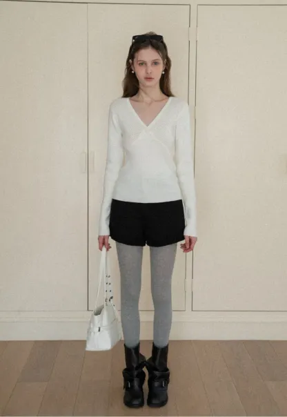 High waist shorts with ruffle hem and belt design