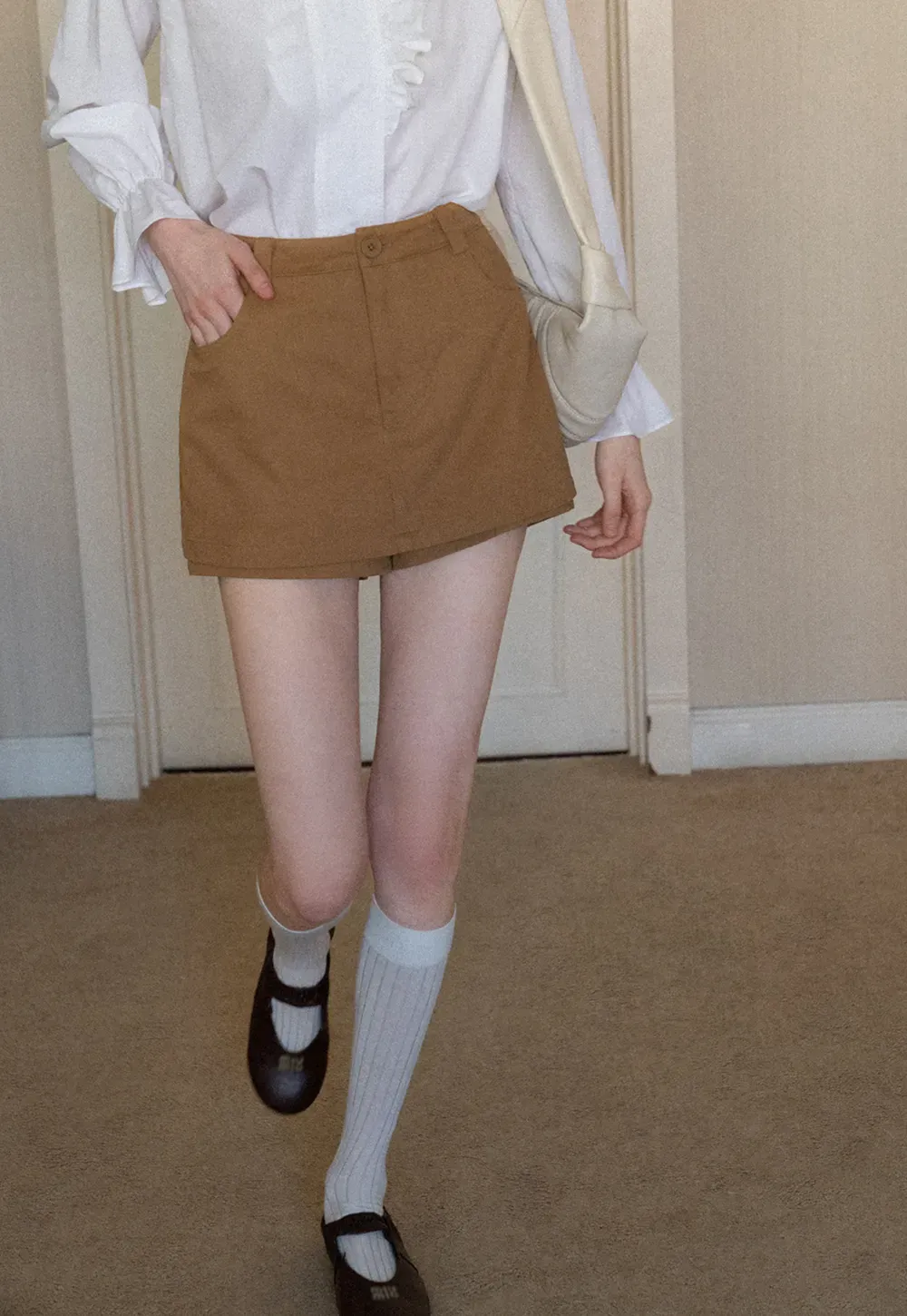 High waist pleated mini skirt with button front design