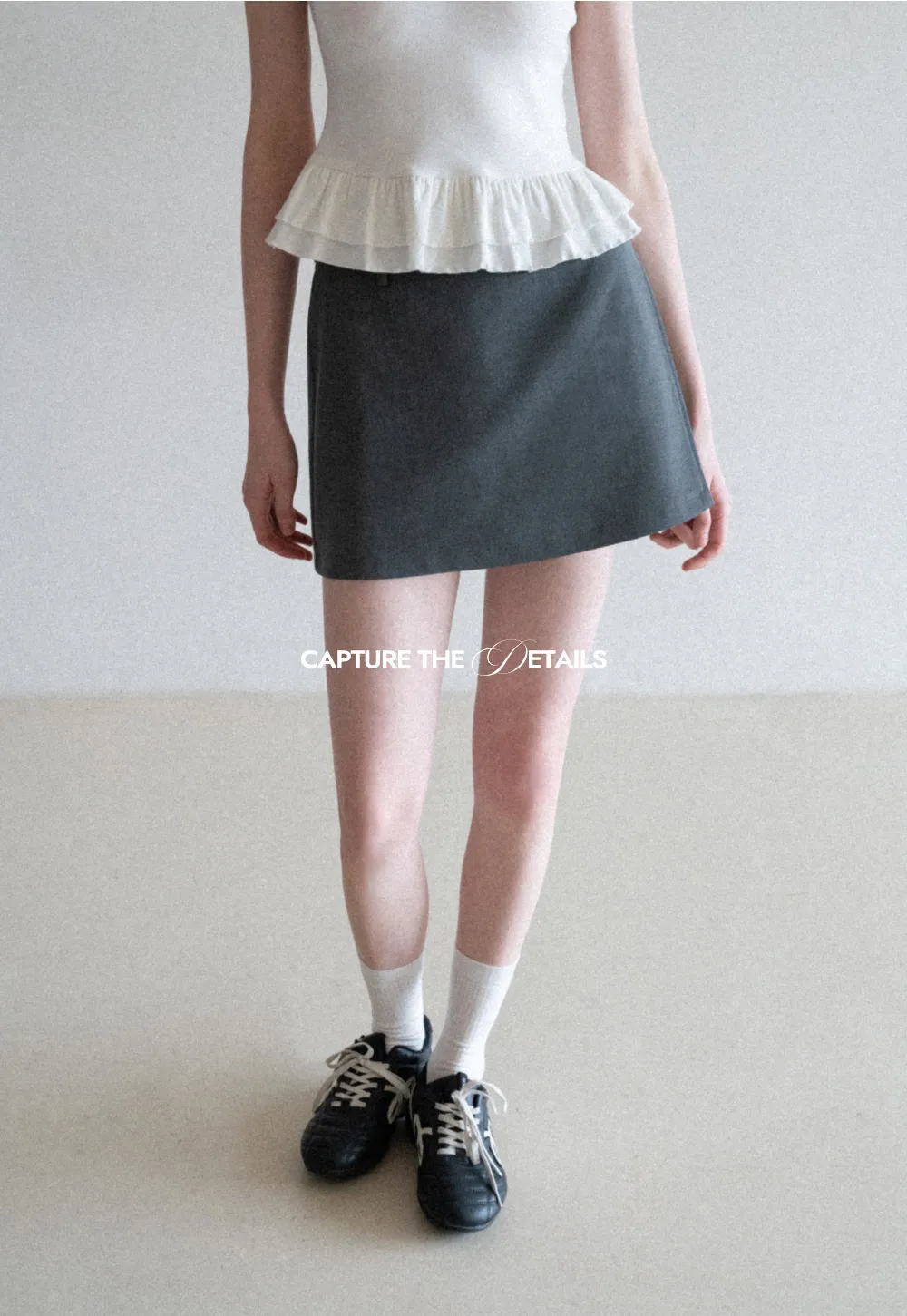 Elegant Pleated Mini Skirt with Asymmetrical Hem