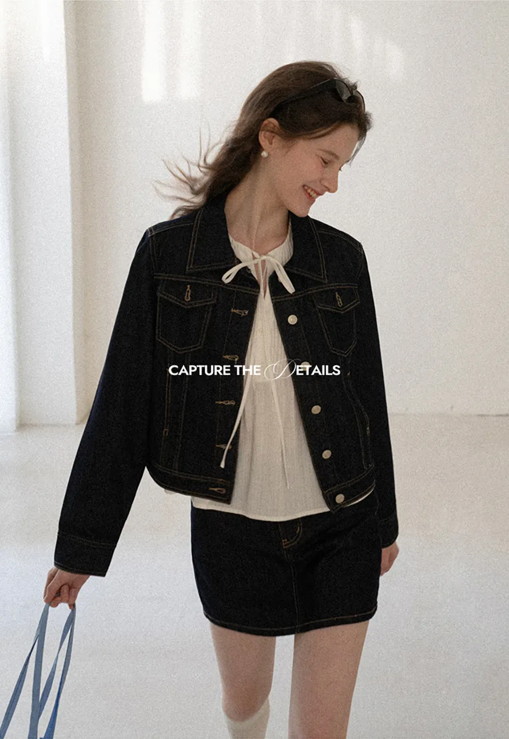 A-line denim skirt with front pocket design and adjustable waistband.