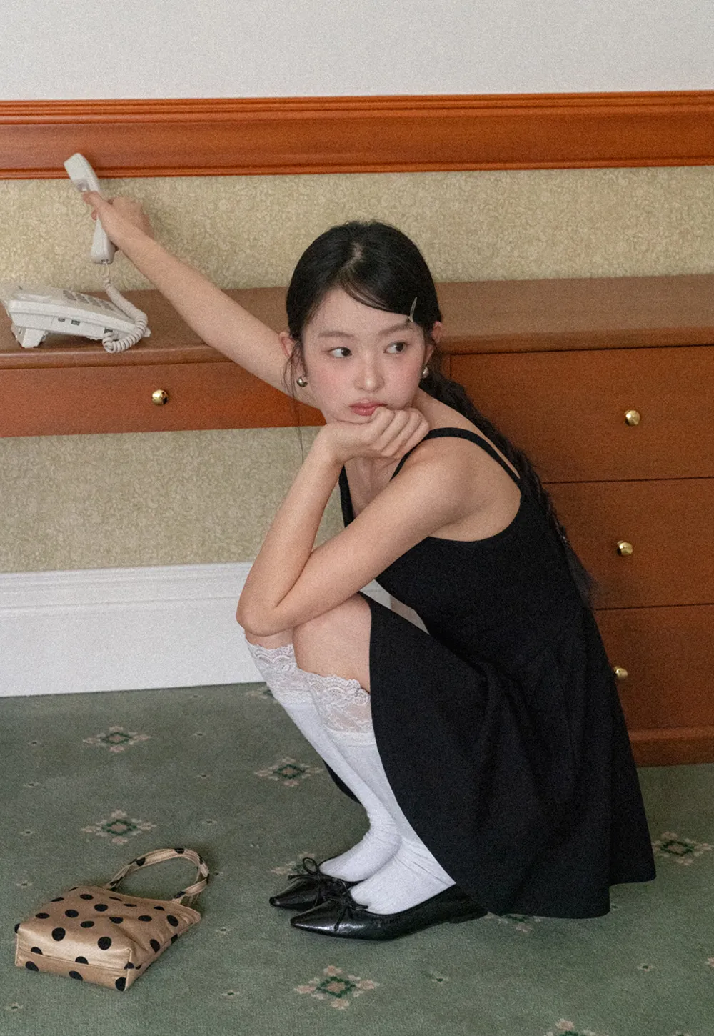 Sleeveless dress with thin straps and flared skirt