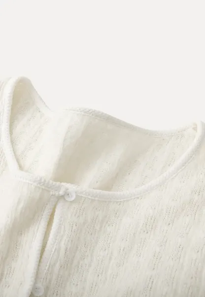 floral lace top with puffed sleeves and ruffled hem