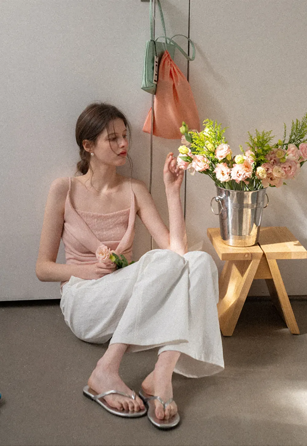 Silk-like tank top with thin straps and draped neckline