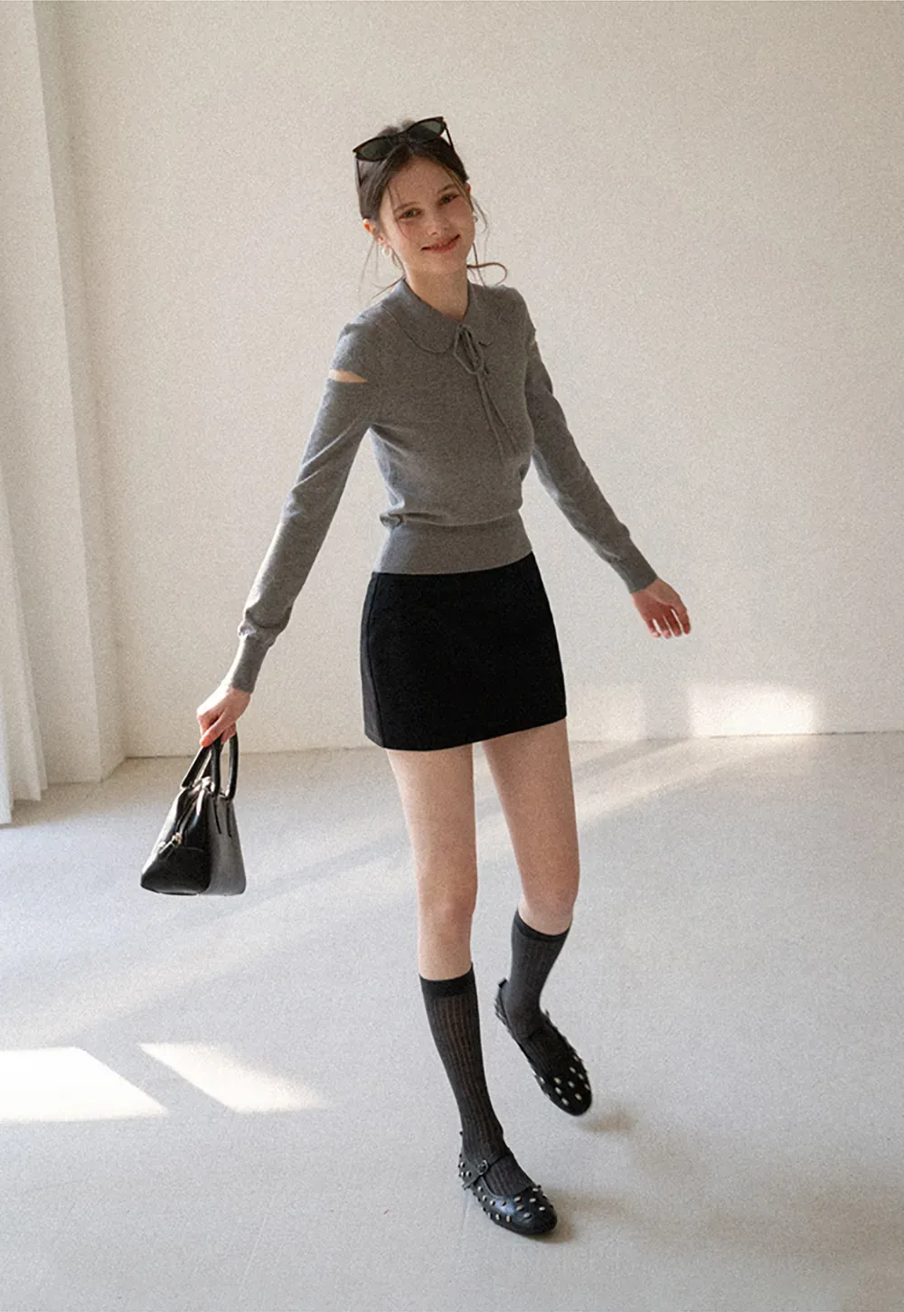 Elegant Knit Sweater with Bow Detail and Cutout Sleeves