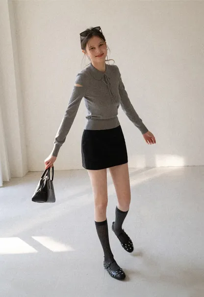 Elegant Knit Sweater with Bow Detail and Cutout Sleeves