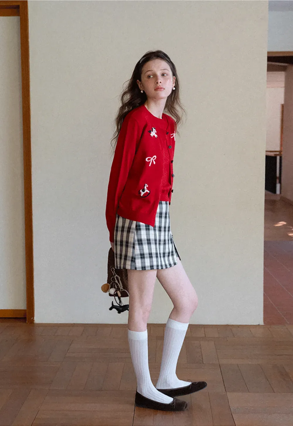 Woolen knit sweater with horse and bow motifs