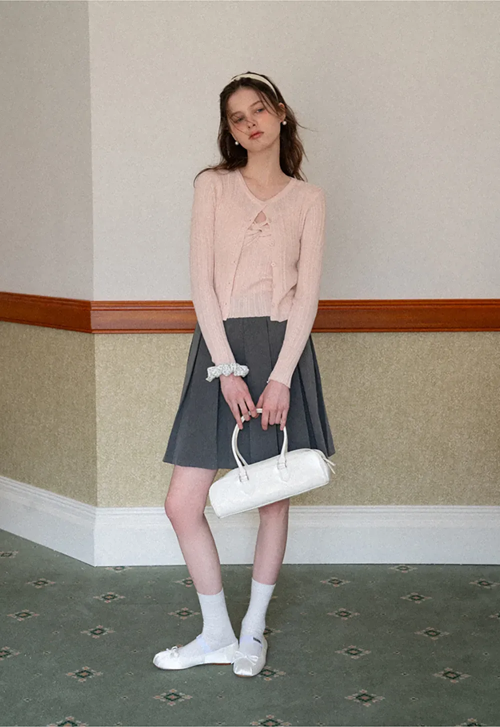 Pleated skirt with front bow detail