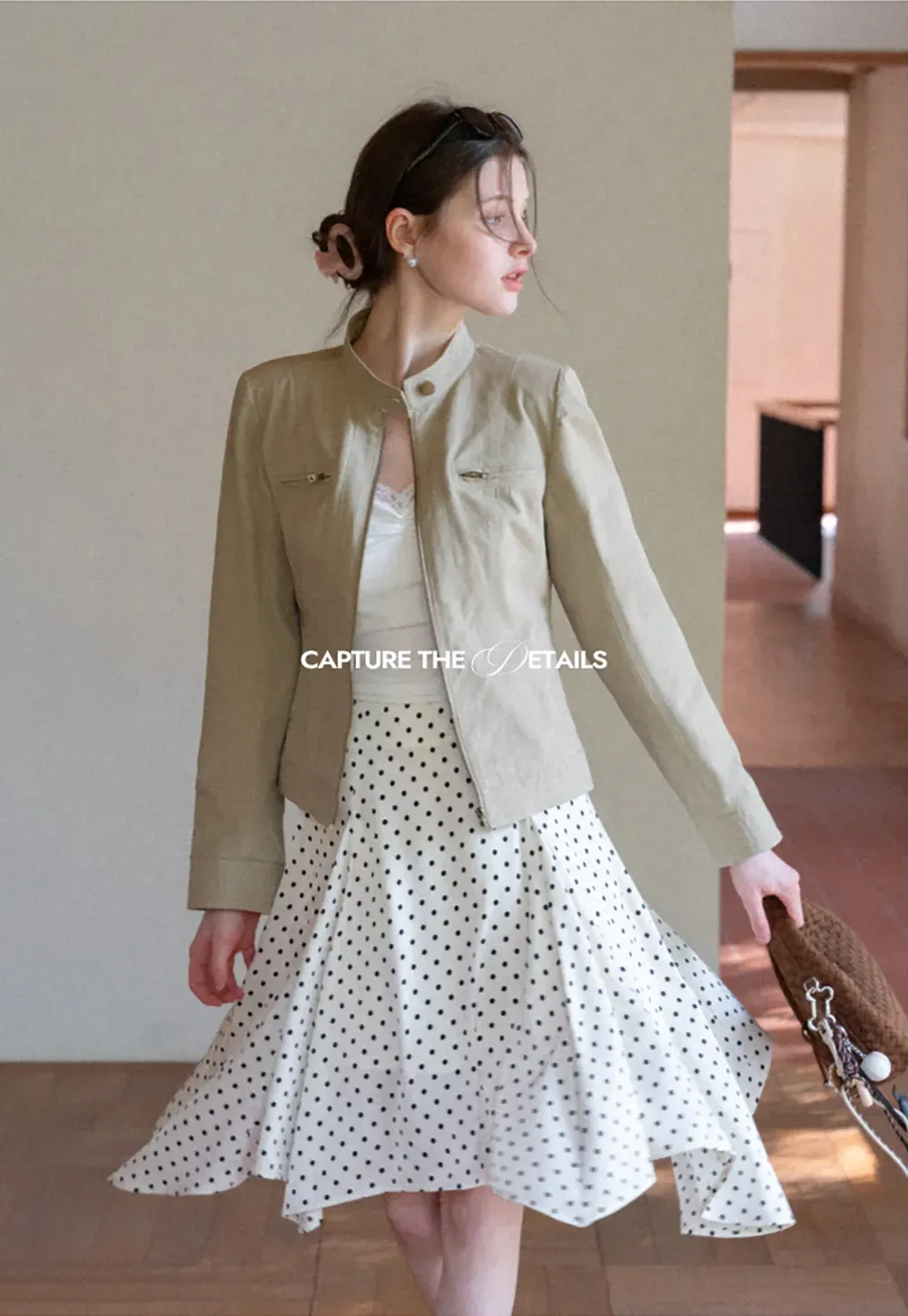 Polka dot asymmetrical hem skirt with pleats