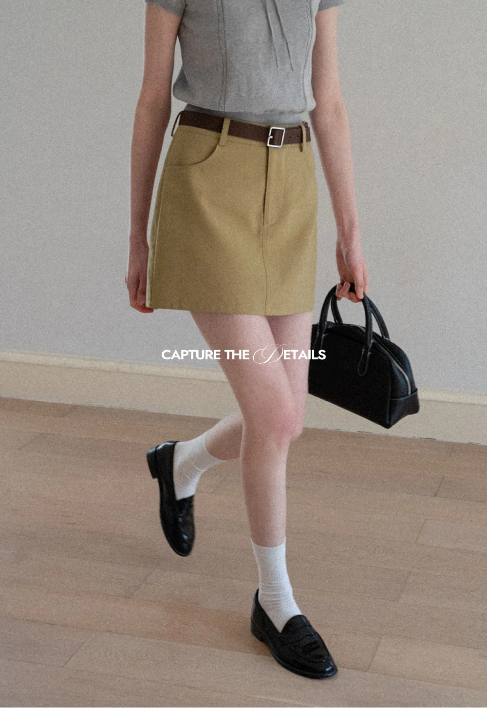 A-line mini skirt with front pockets and belt loops