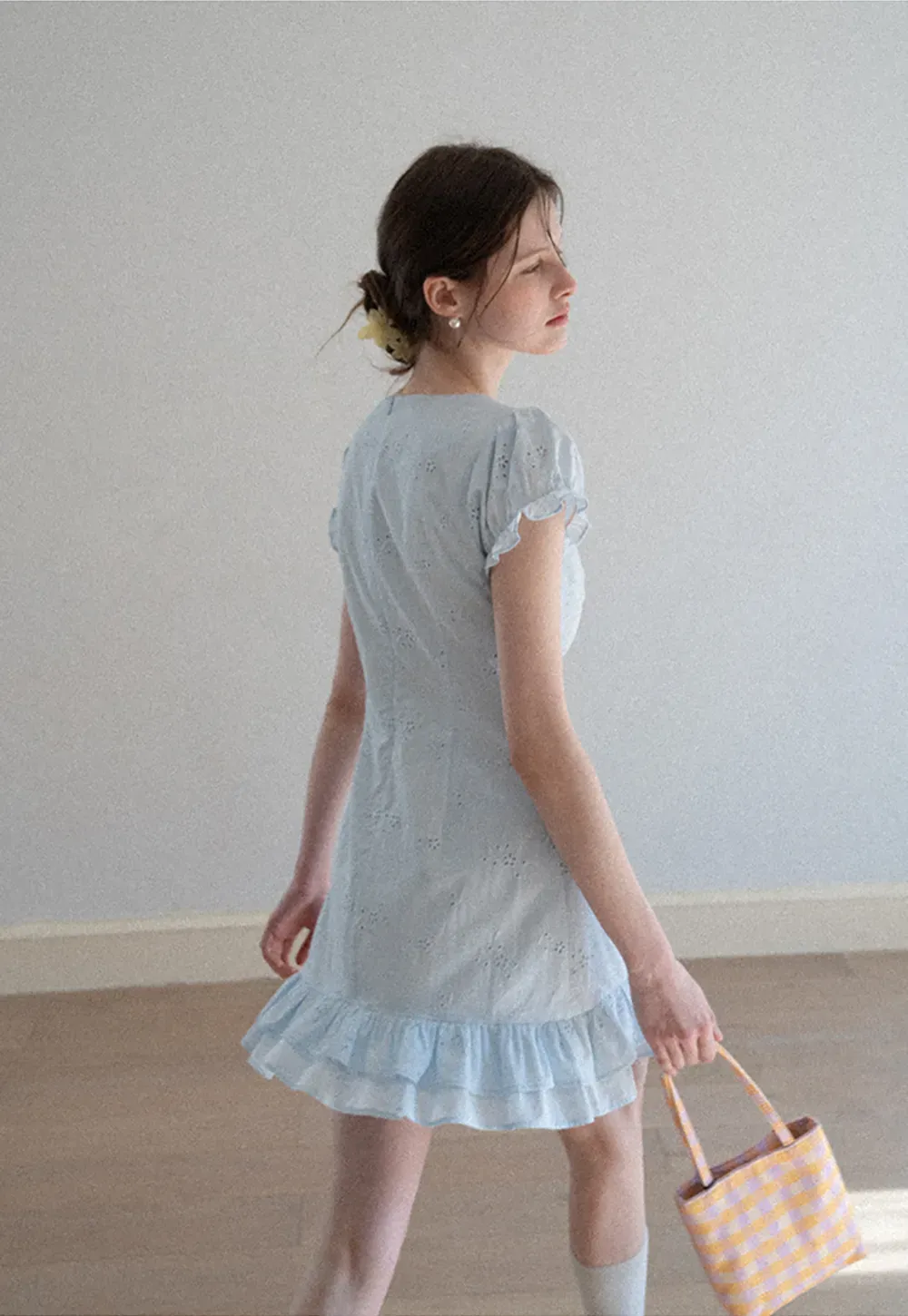 Eyelet dress with puff sleeves and ruffled hem