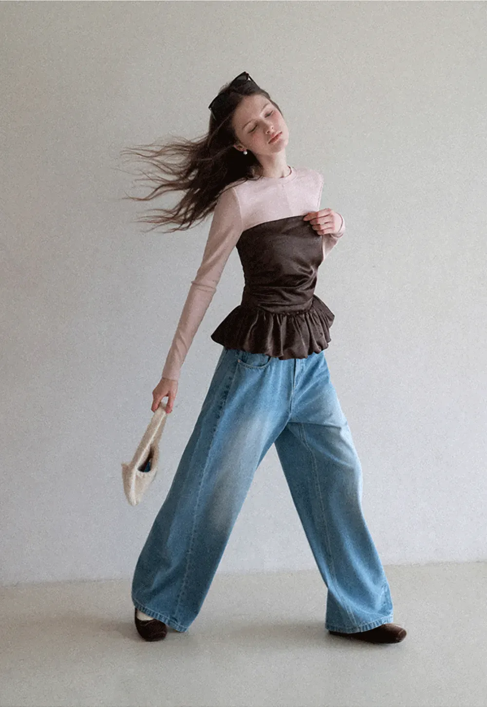 Long sleeve top with ruffled hem and layered design