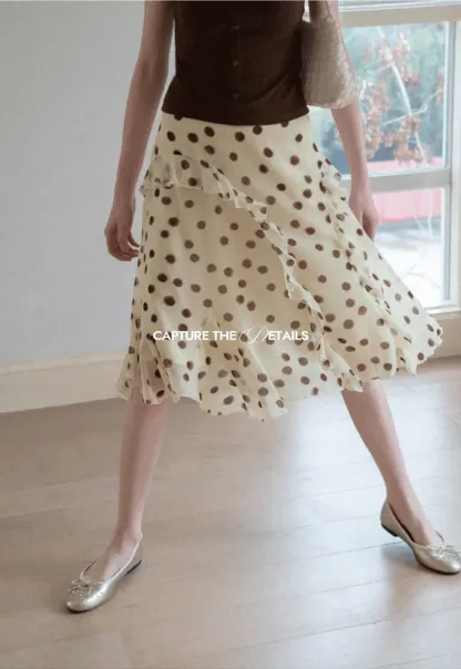 Polka dot ruffled asymmetrical midi skirt