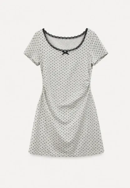 Polka dot dress with lace trim and matching cardigan
