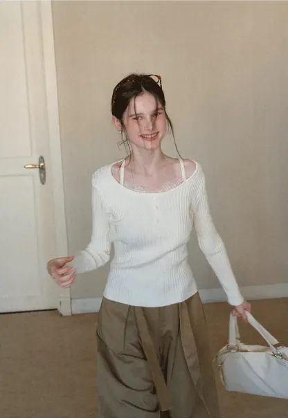 Ribbed knit sweater with boat neck and long sleeves