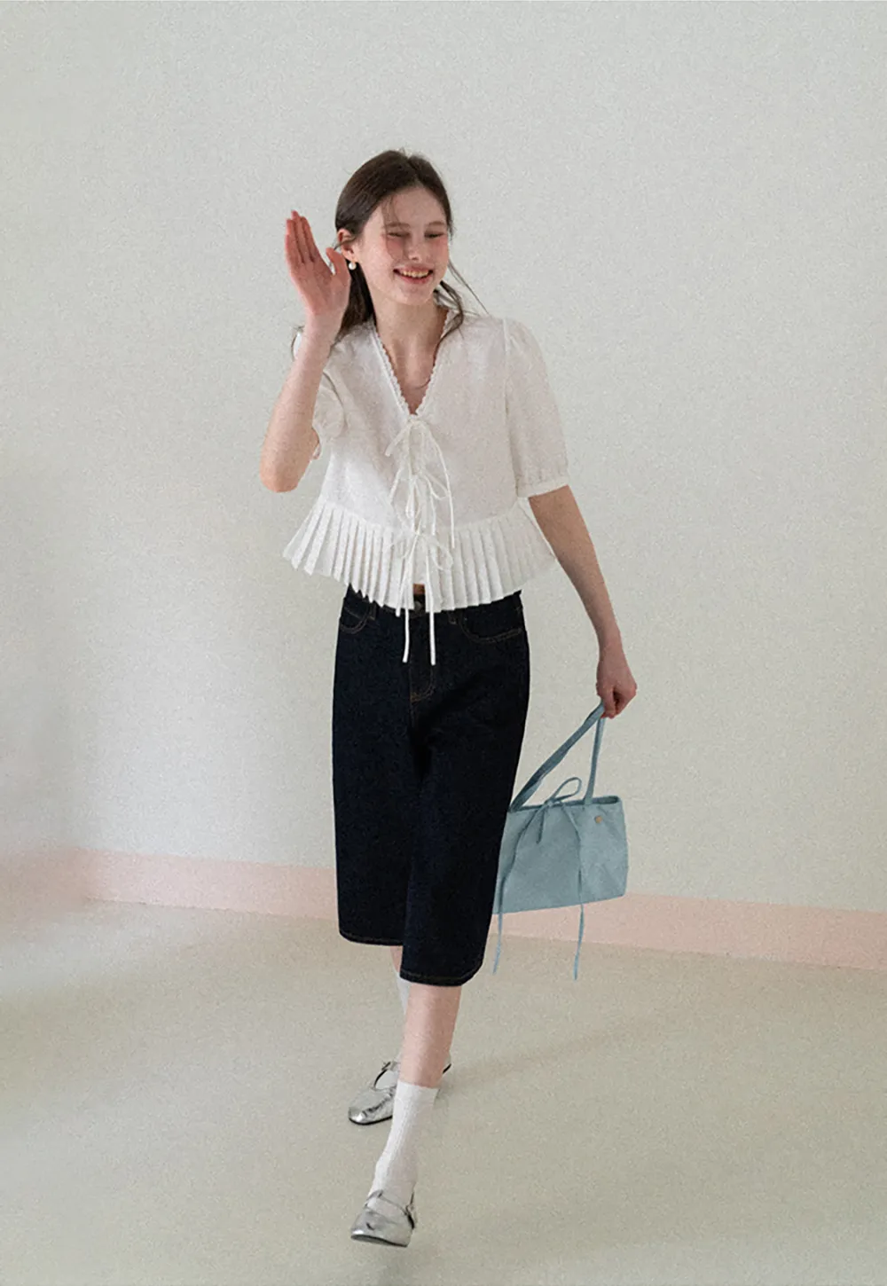 V neck short sleeve blouse with pleated hem and tie front
