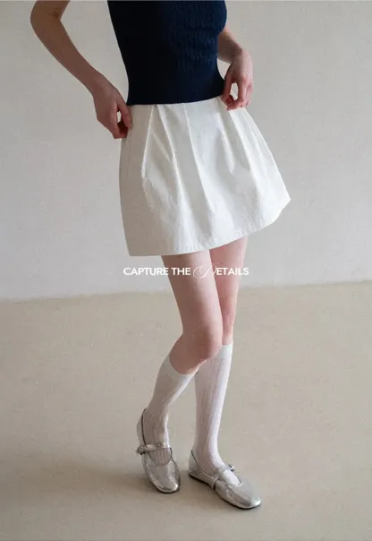 Plaid skirt with pleats and ruffled top