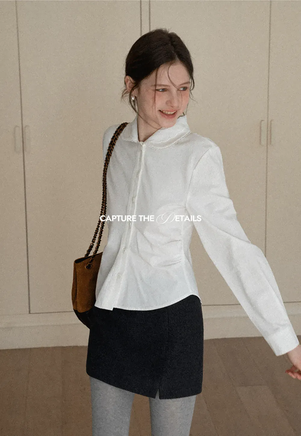 Elegant blouse with scalloped collar and long sleeves for versatile styling