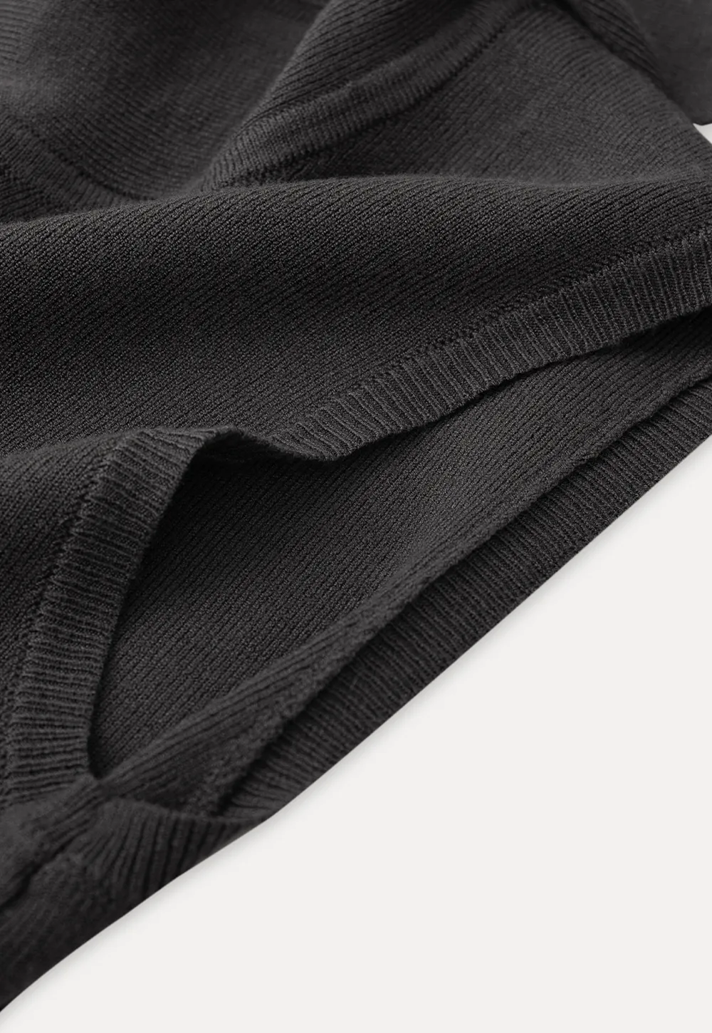 Sleeveless high neck knit top with side tie detail