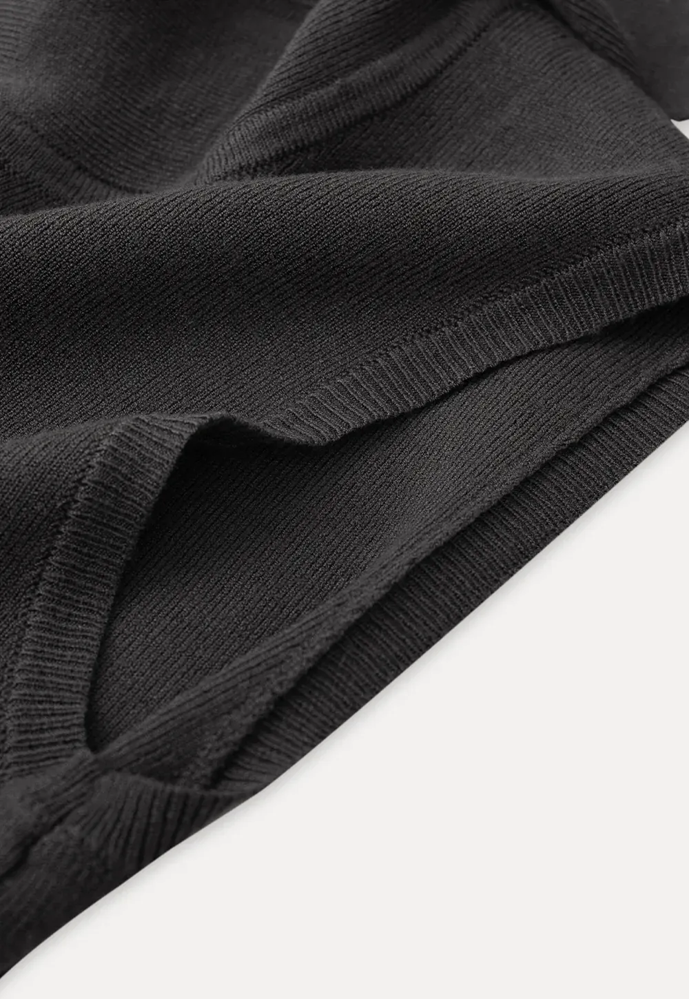 Sleeveless high neck knit top with side tie detail