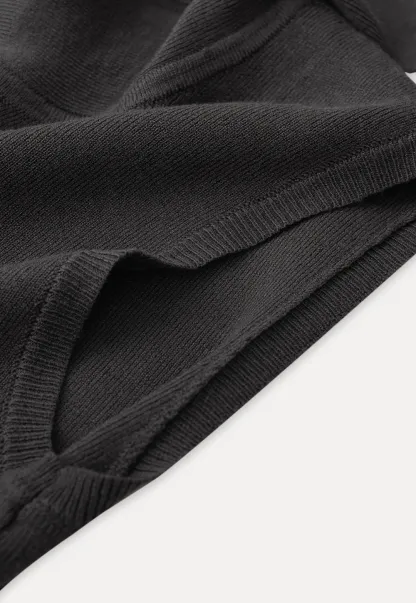 Sleeveless high neck knit top with side tie detail