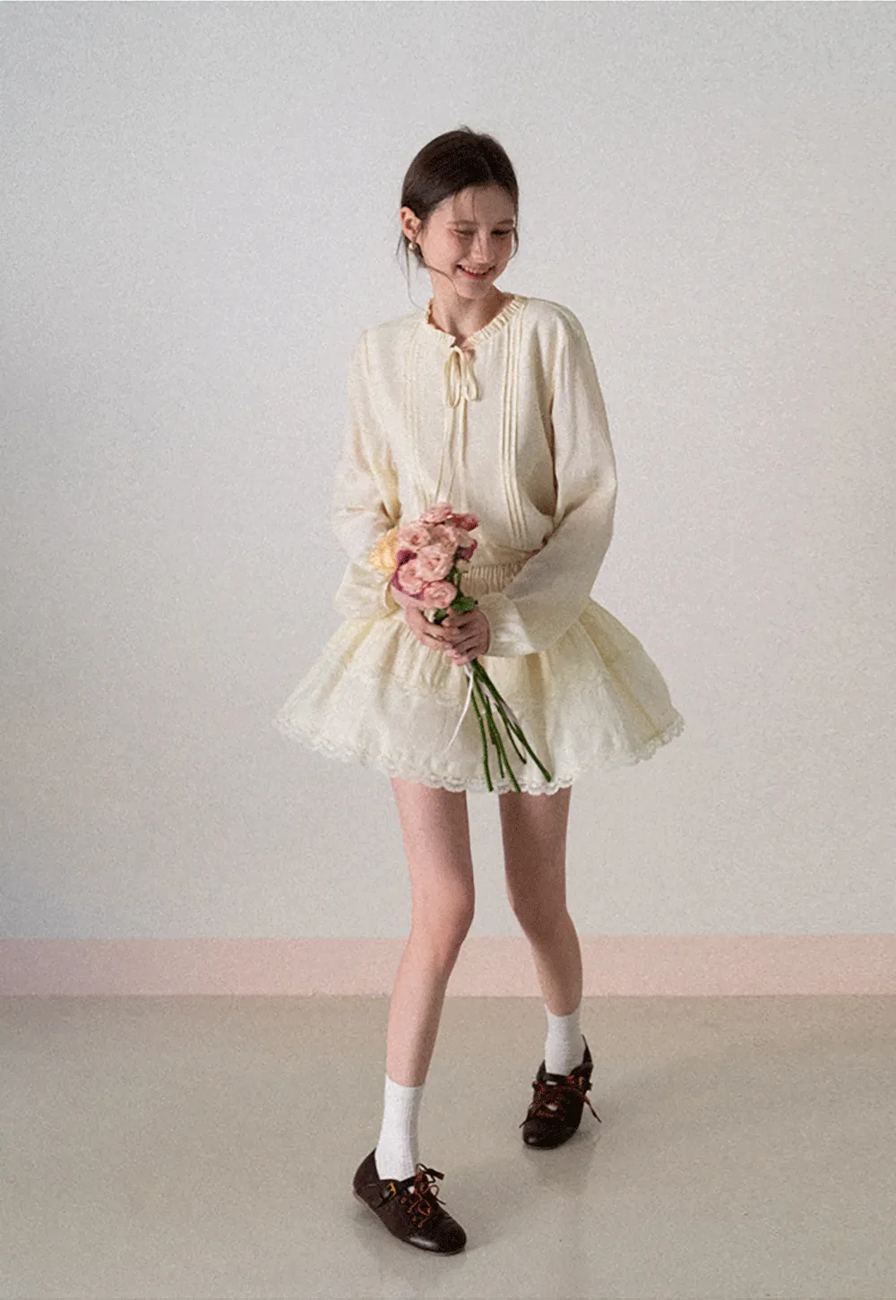 Shirt with ruffled collar and tie front layered skirt