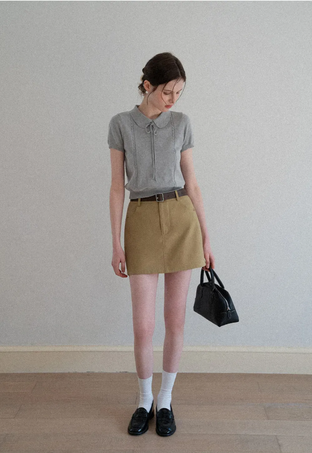 A-line mini skirt with front pockets and belt loops