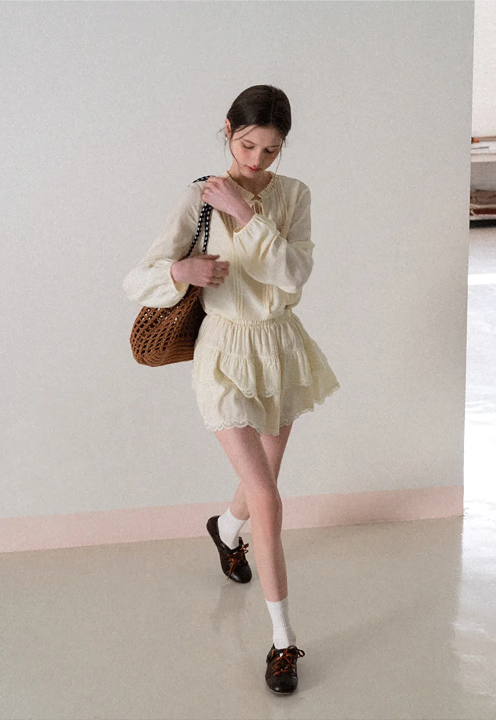 Shirt with ruffled collar and tie front layered skirt