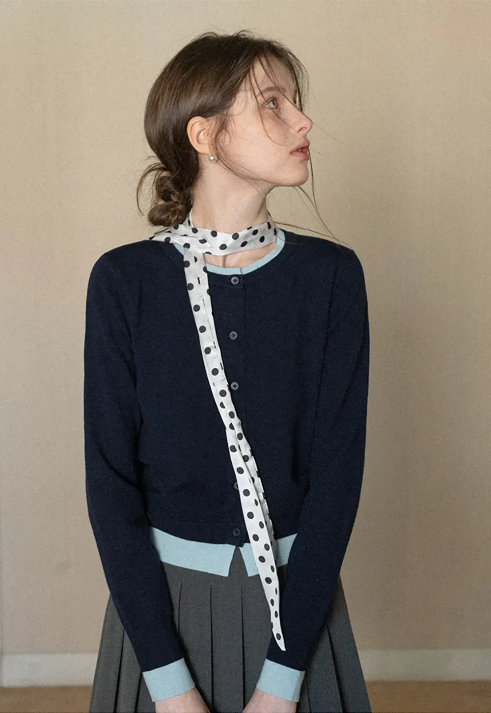 Elegant polka dot neck tie with bow design for women's fashion.