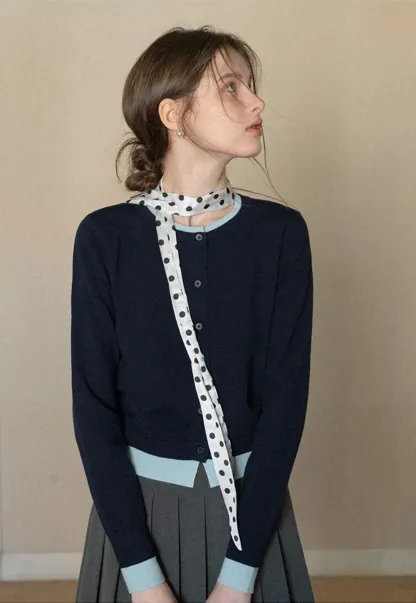 Elegant polka dot neck tie with bow design for women's fashion.