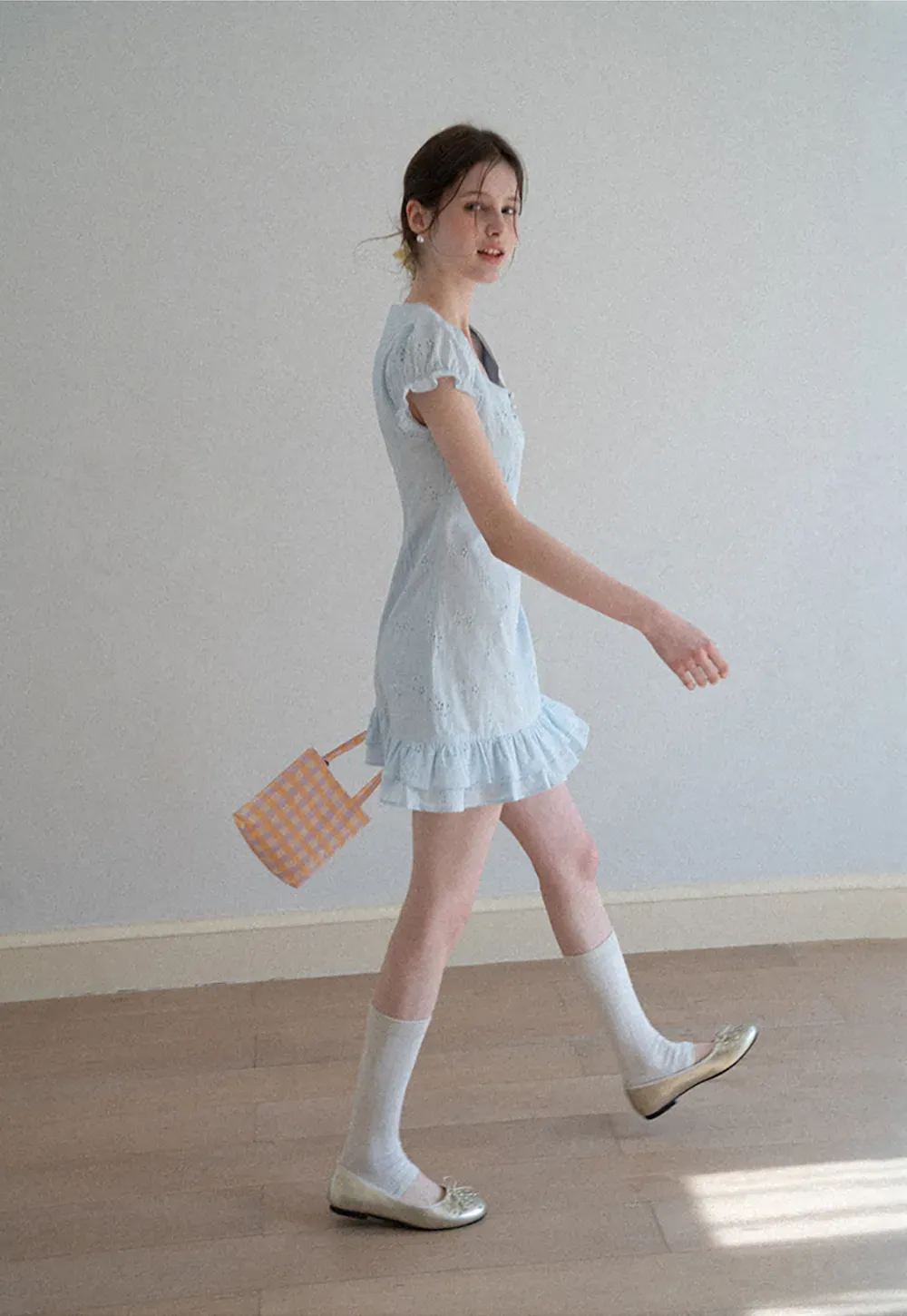 Eyelet dress with puff sleeves and ruffled hem