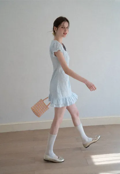 Eyelet dress with puff sleeves and ruffled hem