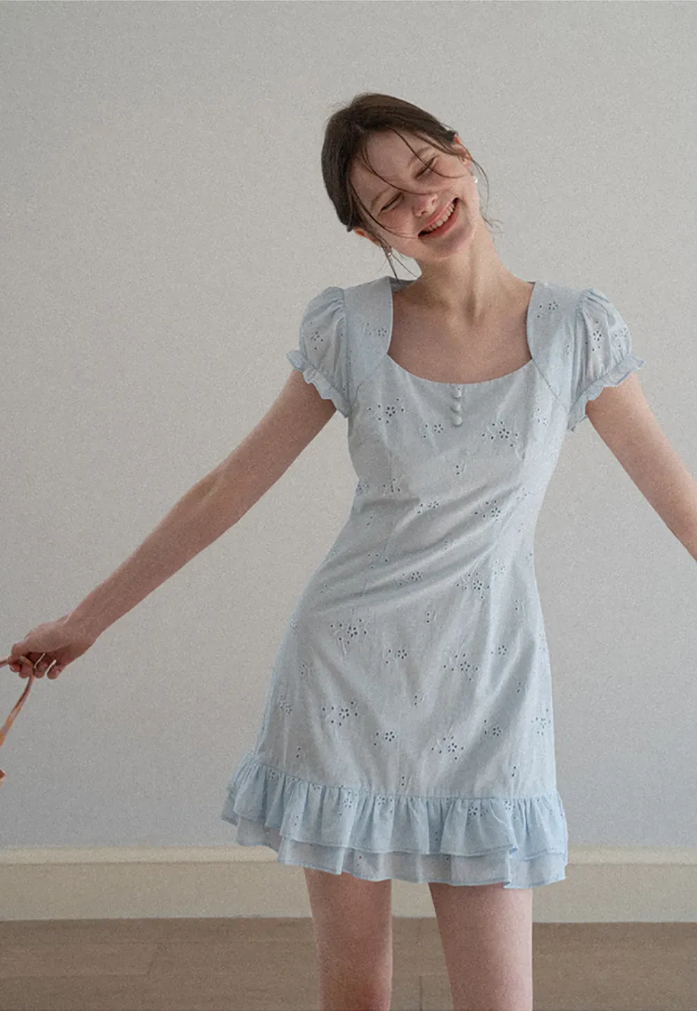 Eyelet dress with puff sleeves and ruffled hem