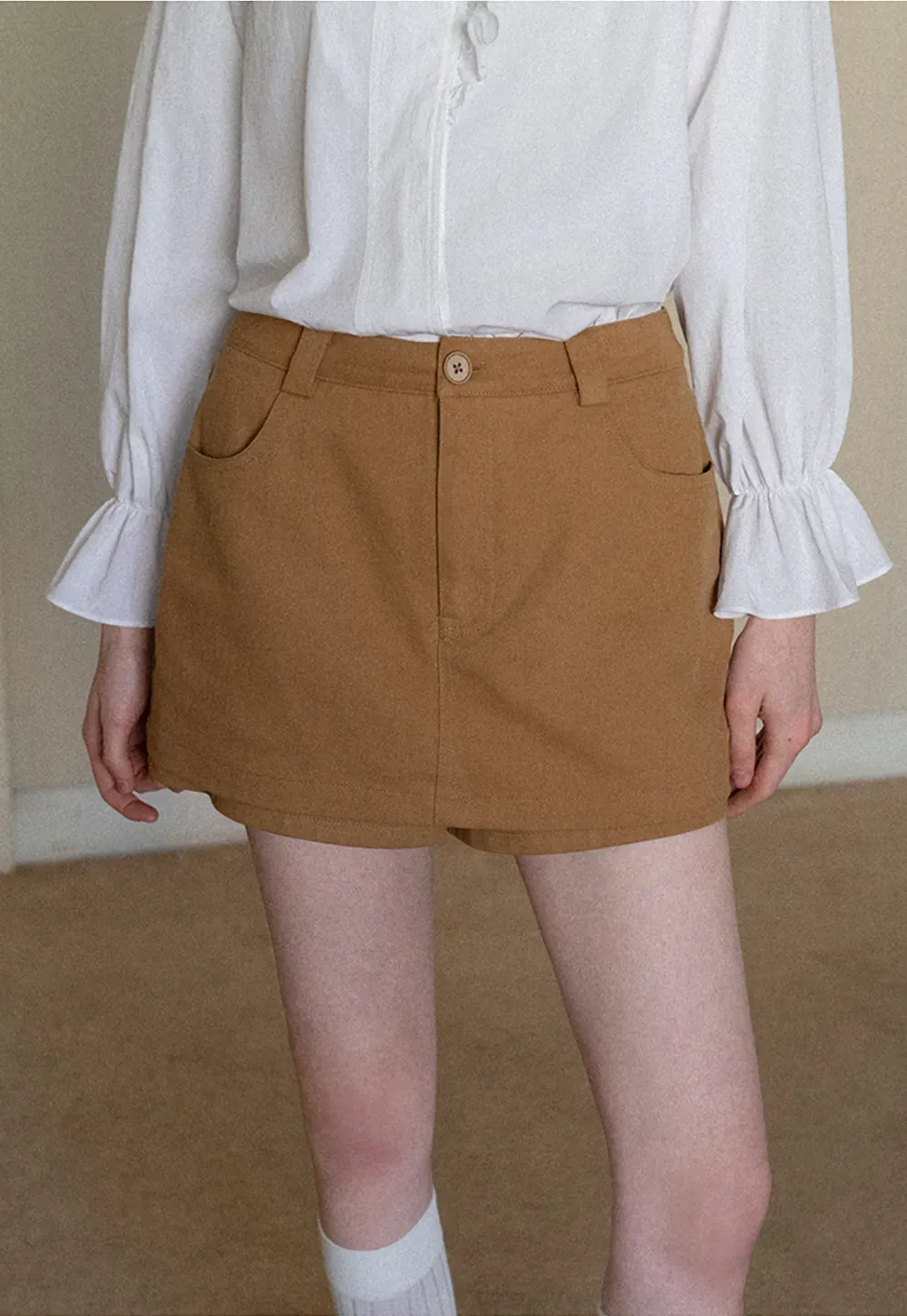 High waist pleated mini skirt with button front design