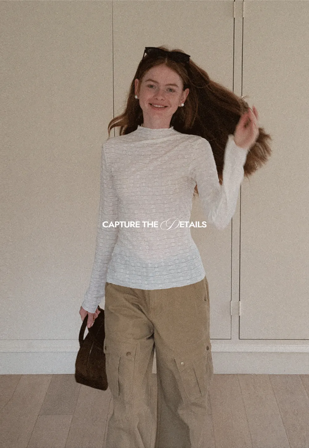 Elegant textured long sleeve top with subtle pattern design