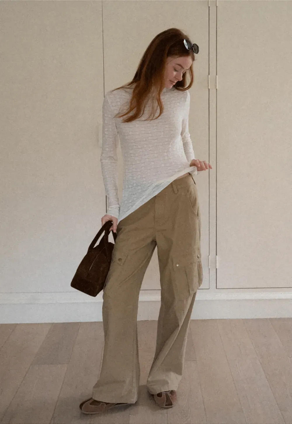 Elegant textured long sleeve top with subtle pattern design