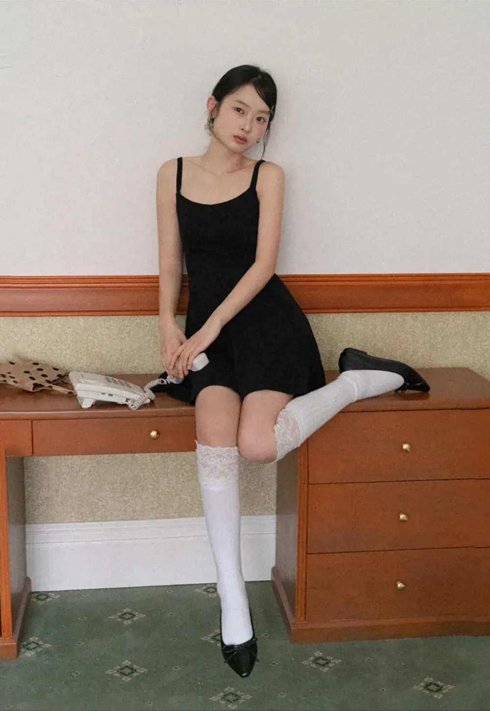 Sleeveless dress with thin straps and flared skirt