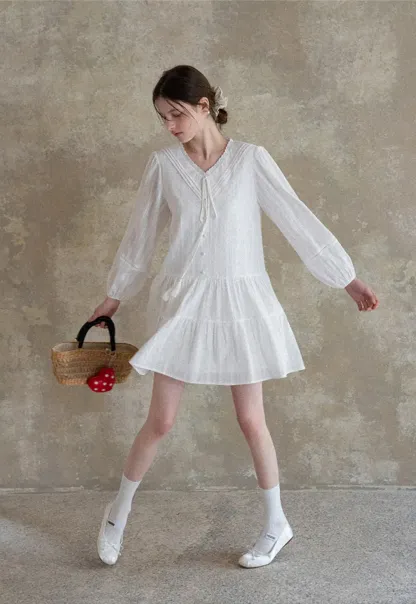 V neck long sleeve tiered dress with lace trim