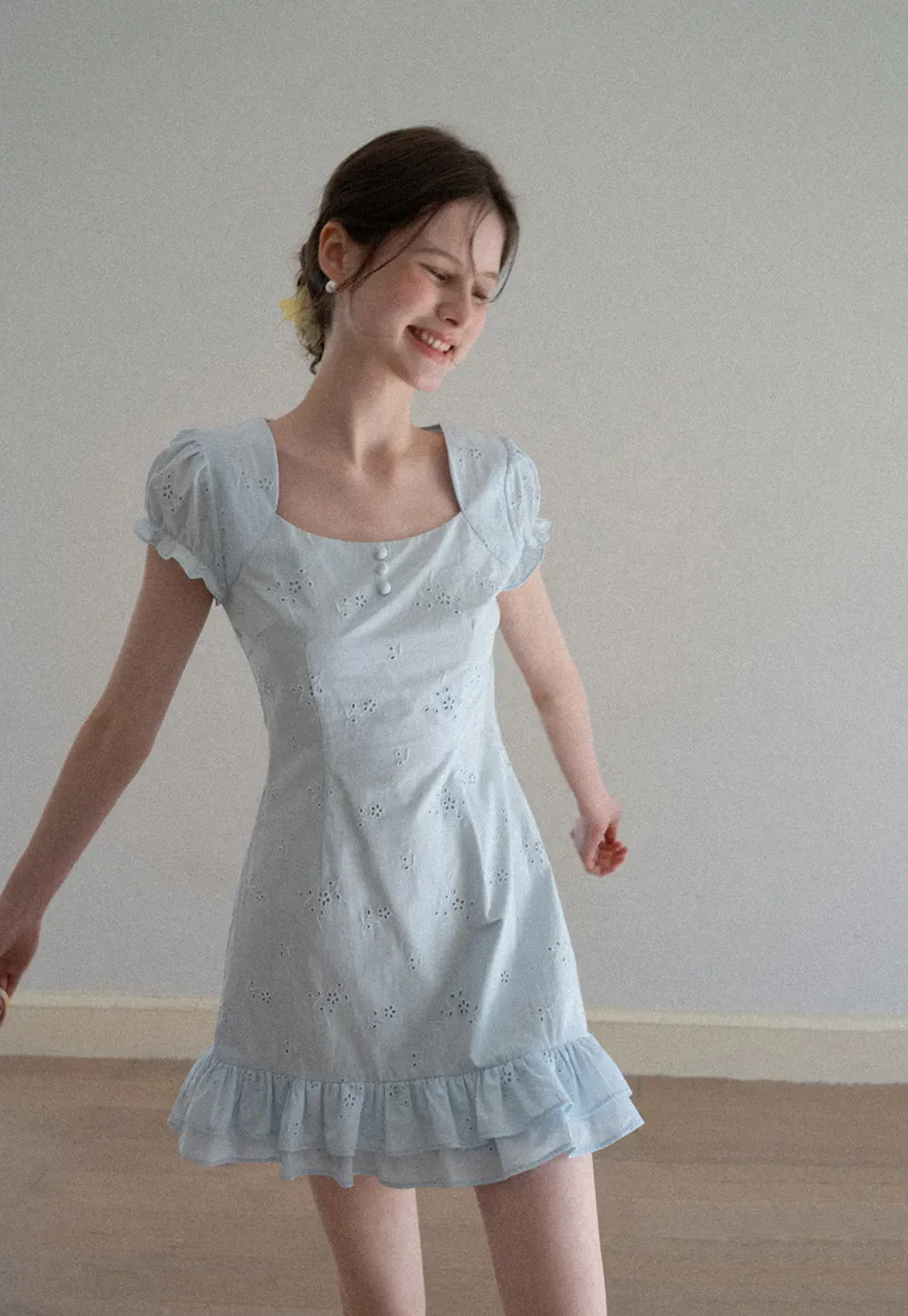 Eyelet dress with puff sleeves and ruffled hem