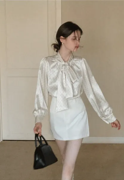 Elegant blouse with bow collar and long sleeves