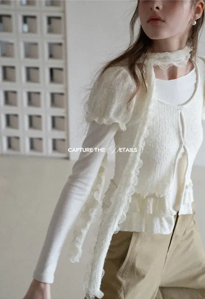 floral lace top with puffed sleeves and ruffled hem