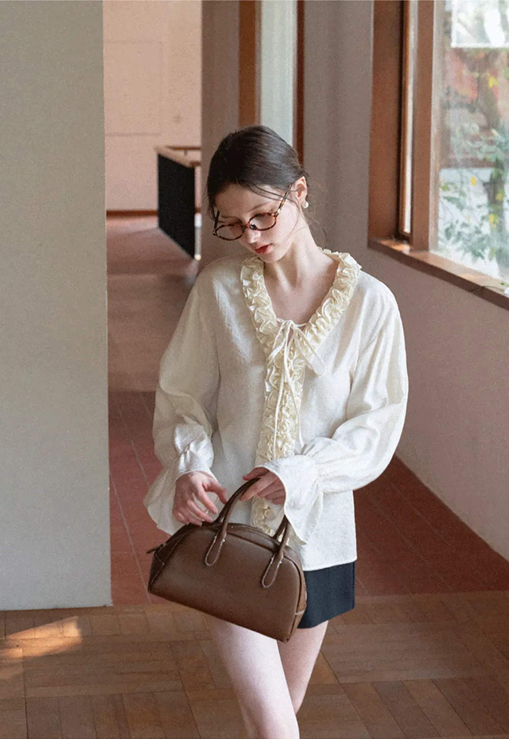 Long sleeve shirt with ruffled neckline and gathered cuffs